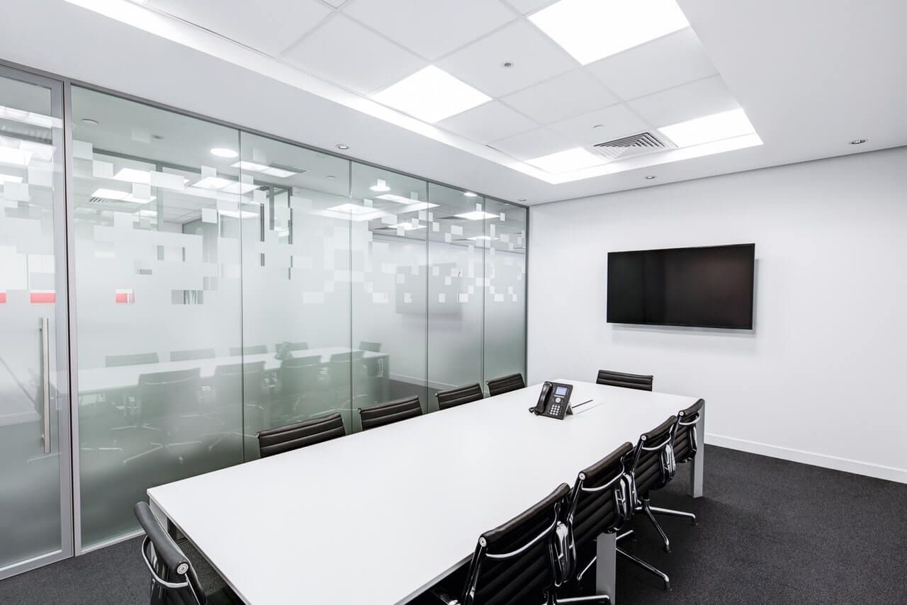 Bright conference room set with rows of seating